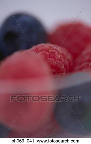 Close up of raspberries and blue berries View Large Photo Image Stock Image - Close up of raspberries and blue berries. Fotosearch