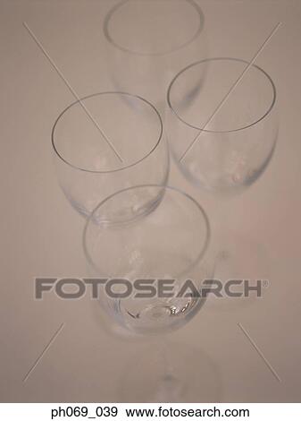 Four wine glasses, elevated view View Large Photo Image Stock Photo - Four wine glasses, elevated view. Fotosearch