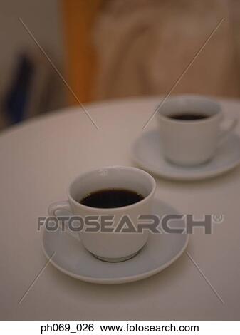 Two cups of black coffee View Large Photo Image Stock Photograph - Two cups of black coffee. Fotosearch