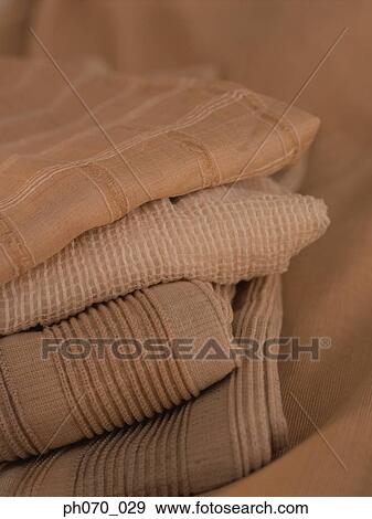 A stake of earth color fabric View Large Photo Image Stock Photo - A stake of earth color fabric. Fotosearch