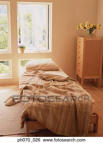 Unmade bed in bedroom View Large Photo Image Stock Photograph - Unmade bed in bedroom. Fotosearch