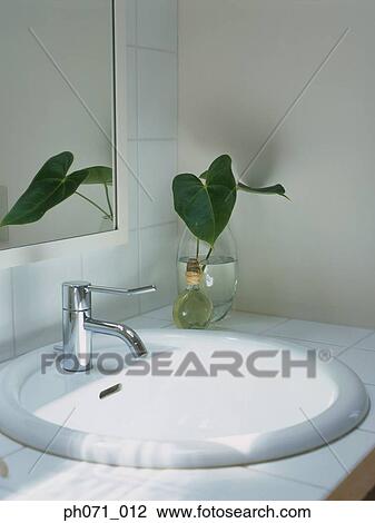 Stock Image - Bathroom sink, close-up. Fotosearch