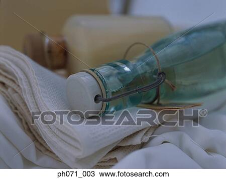 Bottles and fabric, close up View Large Photo Image Stock Image - Bottles and fabric, close up. Fotosearch