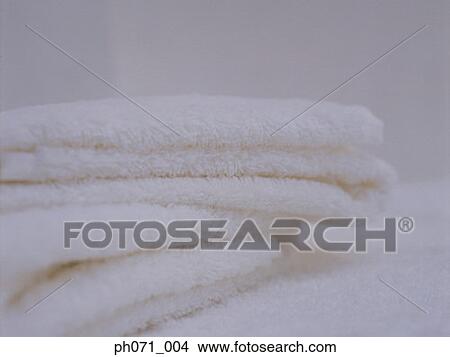 Folded white towels, close-up View Large Photo Image Picture - Folded white towels, close-up . Fotosearch