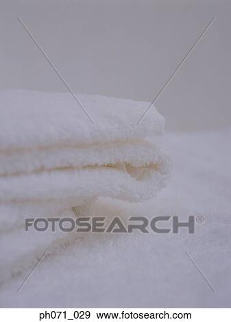 Folded white towels, close-up View Large Photo Image Stock Photo - Folded white towels, close-up . Fotosearch