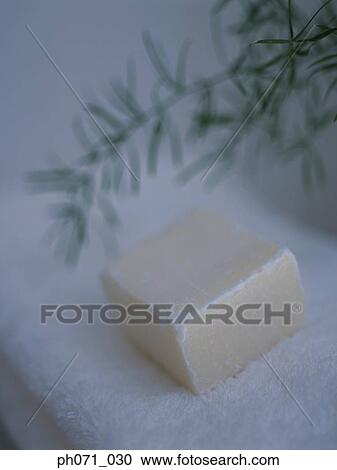 Soap lying on folded white towels, close up View Large Photo Image Stock Image - Soap lying on folded white towels, close up. Fotosearch