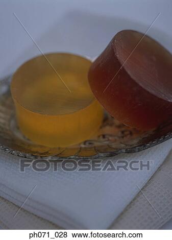 Stack of towels and a plate of soap bars View Large Photo Image Stock Photo - Stack of towels and a plate of soap bars. Fotosearch