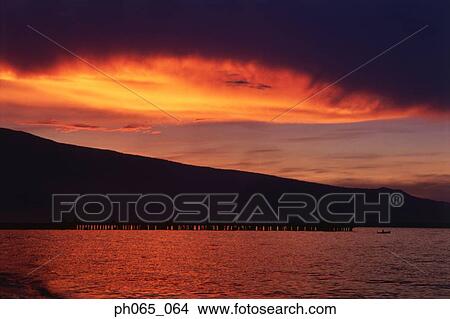 A view of a sunset over mountain View Large Photo Image Picture - A view of a sunset over mountain. Fotosearch