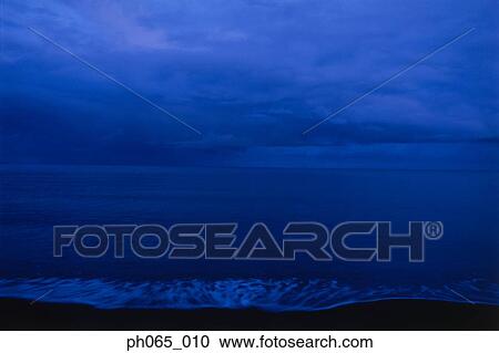 Clouds over sea at dawn View Large Photo Image Stock Image - Clouds over sea at dawn. Fotosearch