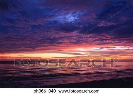 Cloudy sky and sea at sunset View Large Photo Image Stock Image - Cloudy sky and sea at sunset . Fotosearch