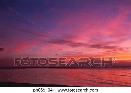 Cloudy sky and sea at sunset View Large Photo Image Stock Image - Cloudy sky and sea at sunset . Fotosearch