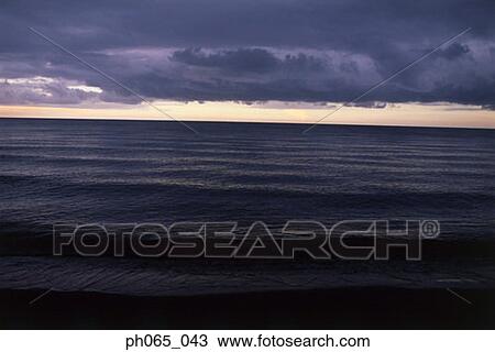 Cloudy sky and sea at sunset View Large Photo Image Stock Image - Cloudy sky and sea at sunset . Fotosearch