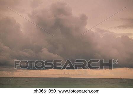 Cloudy sky and sea at sunset View Large Photo Image Stock Image - Cloudy sky and sea at sunset . Fotosearch