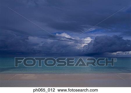 Storm clouds over beach View Large Photo Image Stock Image - Storm clouds over beach. Fotosearch