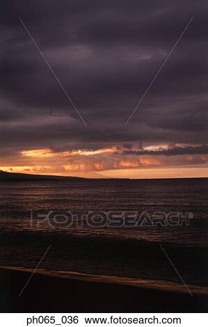 Stock Photograph - Storm clouds over beach. Fotosearch