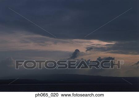 Storm clouds over ocean View Large Photo Image Stock Image - Storm clouds over ocean. Fotosearch