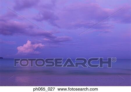 Sunset clouds over ocean View Large Photo Image Stock Photo - Sunset clouds over ocean. Fotosearch