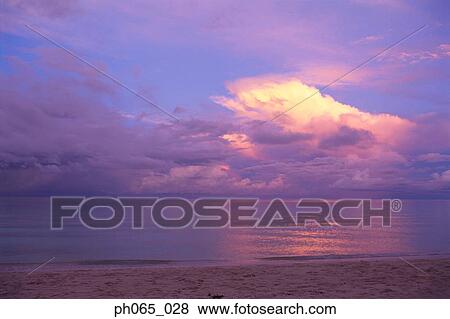 Sunset clouds over ocean View Large Photo Image Stock Photo - Sunset clouds over ocean. Fotosearch