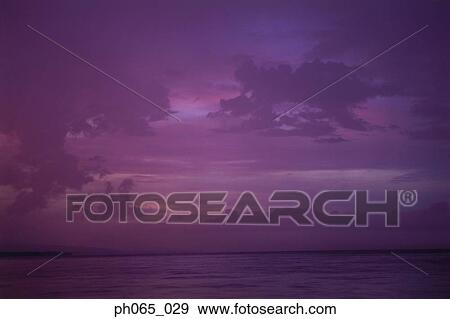 Sunset clouds over ocean View Large Photo Image Stock Photo - Sunset clouds over ocean. Fotosearch