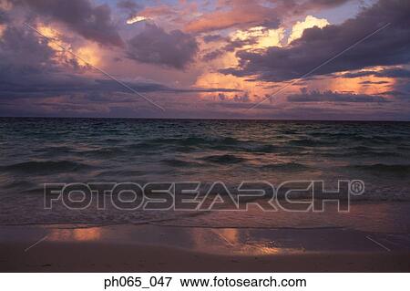 Sunset clouds over ocean View Large Photo Image Stock Photo - Sunset clouds over ocean. Fotosearch