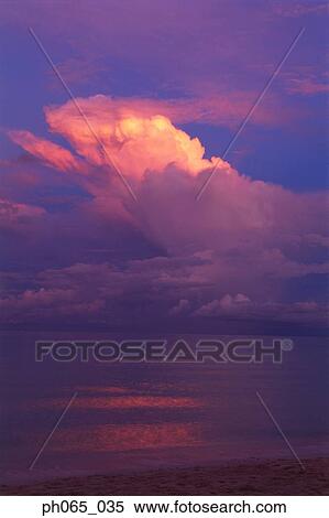 Sunset clouds over ocean View Large Photo Image Stock Photography - Sunset clouds over ocean. Fotosearch