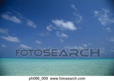Cloudy sky over clear ocean View Large Photo Image Stock Photo - Cloudy sky over clear ocean . Fotosearch
