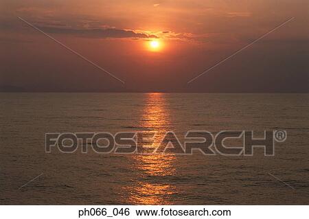 Stock Photograph - Ocean sunset . Fotosearch