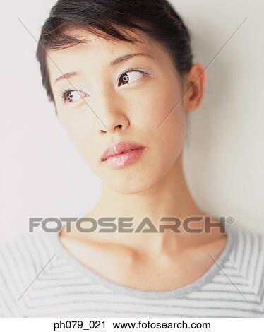 Young woman, close-up, portrait View Large Photo Image Stock Image - Young woman, close-up, portrait. Fotosearch