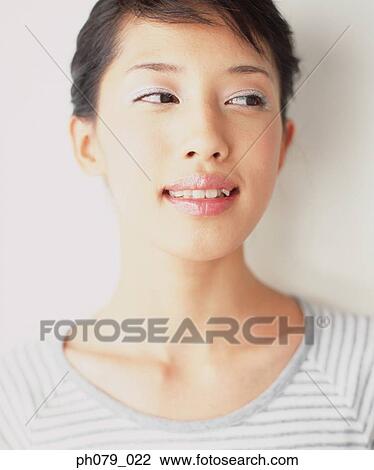 Young woman, close-up, portrait View Large Photo Image Stock Image - Young woman, close-up, portrait. Fotosearch