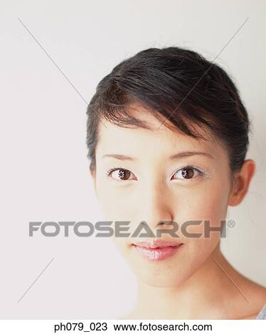 Stock Image - Young woman, close-up, portrait. Fotosearch