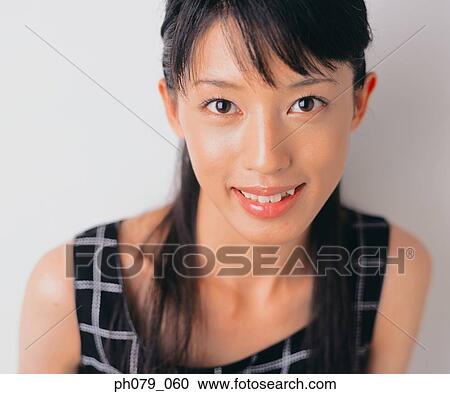 Stock Image - Young woman, close-up, portrait. Fotosearch