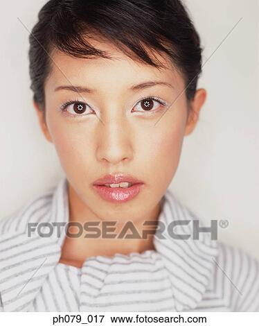 Stock Photo - Young woman, close-up, portrait. Fotosearch