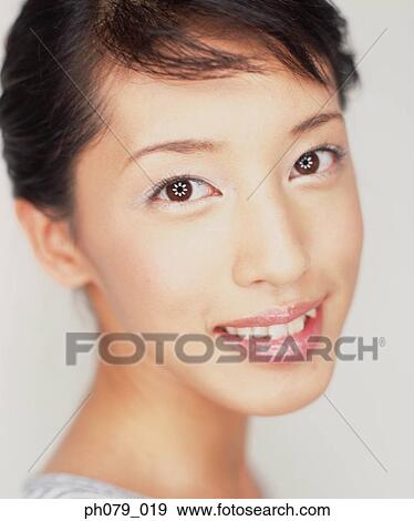 Stock Photo - Young woman, close-up, portrait. Fotosearch