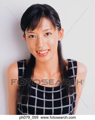 Stock Photo - Young woman, close-up, portrait. Fotosearch