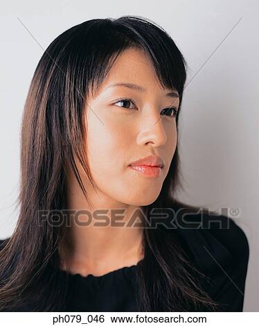 Stock Photograph - Young woman, close-up, portrait. Fotosearch