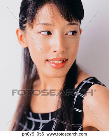 Stock Photograph - Young woman, close-up, portrait. Fotosearch
