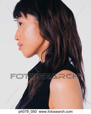 Stock Image - Young woman, close-up, profile . Fotosearch