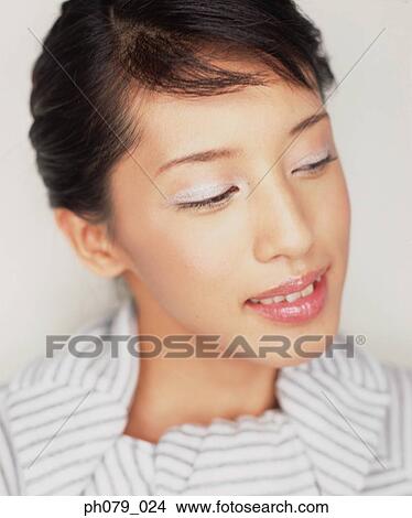 Picture - Young woman, eyes closed, close-up, profile . Fotosearch