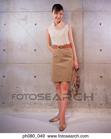 Stock Photo - Portrait of a smiling woman, posing. Fotosearch
