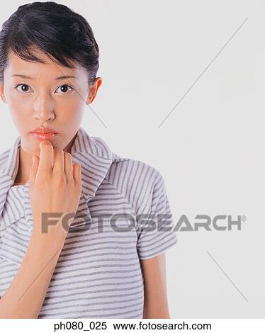 Stock Photography - Portrait of a young woman, posing. Fotosearch