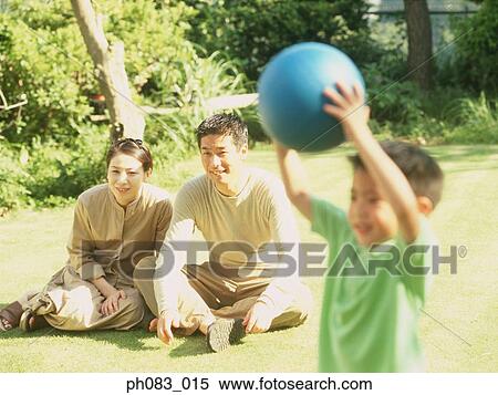 Father and mother watching son playing ball games View Large Photo Image Stock Photography - Father and mother watching son playing ball games. Fotosearch