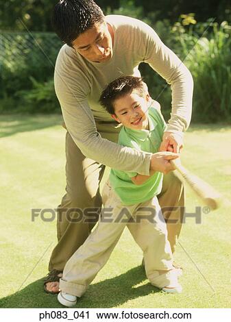 Father and son playing baseball View Large Photo Image Stock Image - Father and son playing baseball. Fotosearch