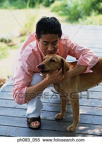 Man hugging dog View Large Photo Image Stock Photography - Man hugging dog. Fotosearch