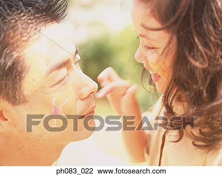 Young daughter painting father's face View Large Photo Image Stock Image - Young daughter painting father's face. Fotosearch