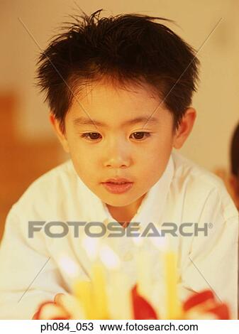 Stock Image - Boy with a birthday cake. Fotosearch