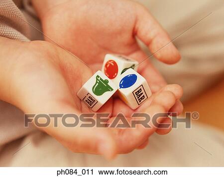 Close-up of opened hands holding dice View Large Photo Image Stock Image - Close-up of opened hands holding dice. Fotosearch