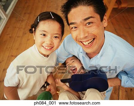 Father and children playing View Large Photo Image Stock Image - Father and children playing. Fotosearch