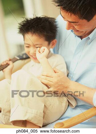 Father and son playing View Large Photo Image Stock Photography - Father and son playing . Fotosearch