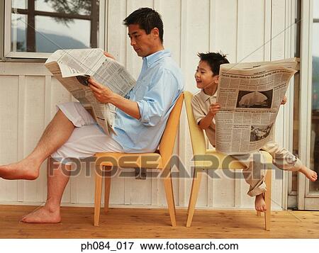 Father and son reading newspaper View Large Photo Image Stock Photo - Father and son reading newspaper. Fotosearch
