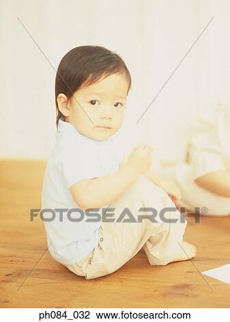 Stock Image - Portrait of a young boy. Fotosearch